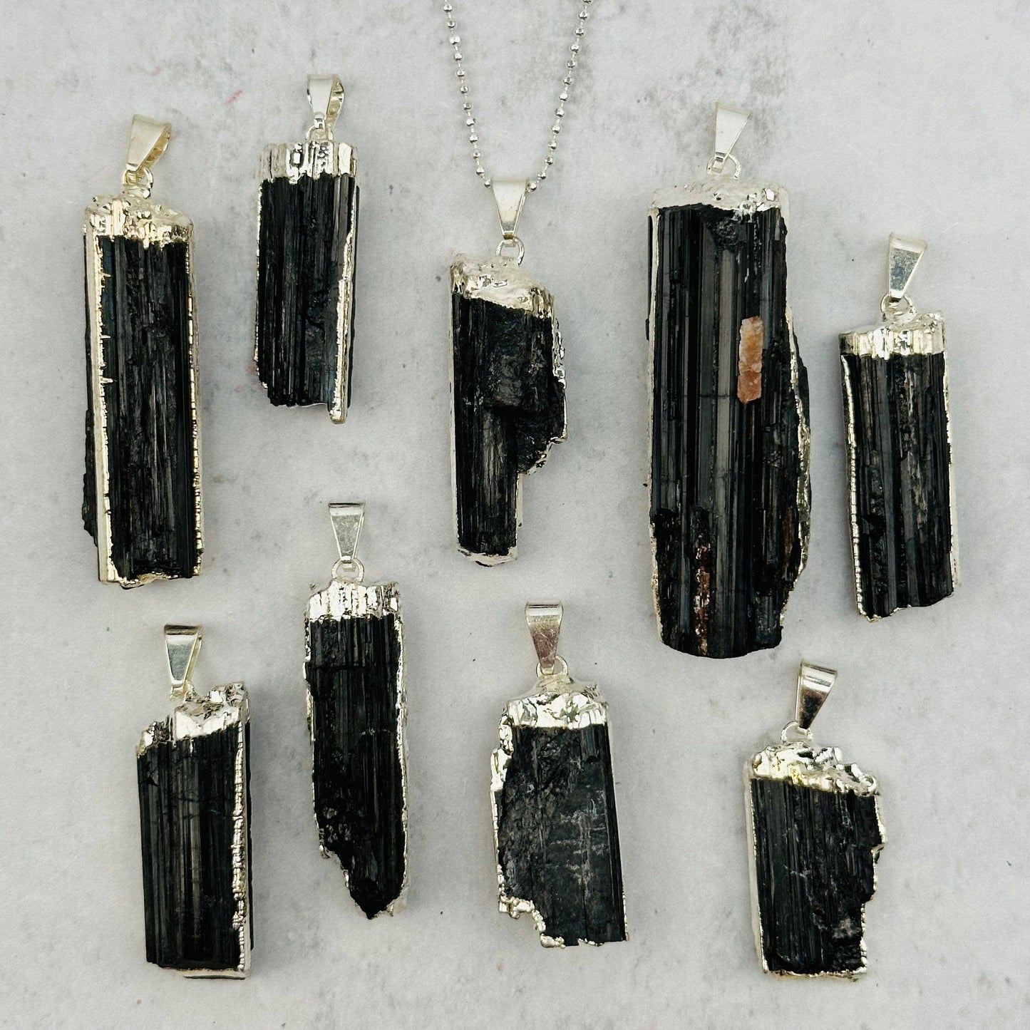 Black Tourmaline Crystal Pendant with Electroplated Silver E